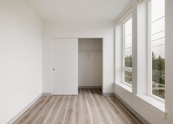 A room with a white door and a window at Nook at Northaven Apartments, Seattle, WA