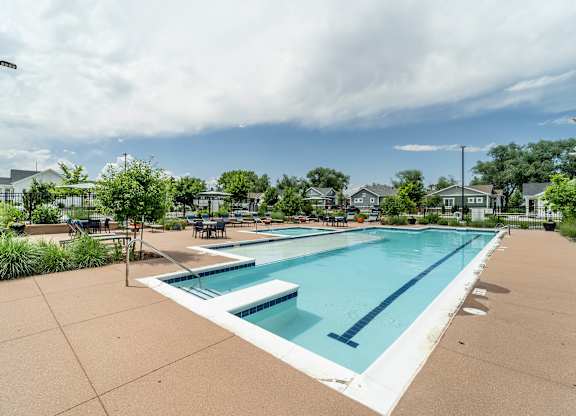 the swimming pool at the estates apartments