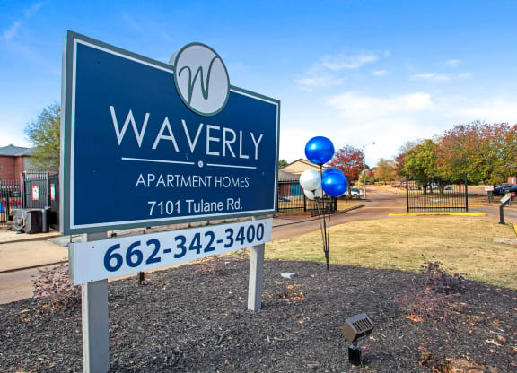 a sign that says waverly apartments