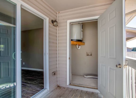 a view of a bathroom from a porch with a door