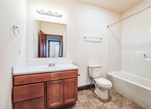 a bathroom with a sink toilet and a bath tub