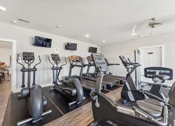 the gym with treadmills and cardio equipment at 1861 muleshoe road apartments