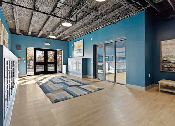 A room with a blue wall and a wooden floor.