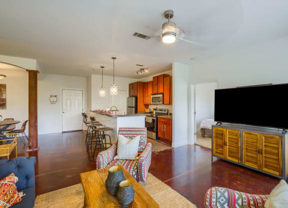 a living room with a couch a table and a television
