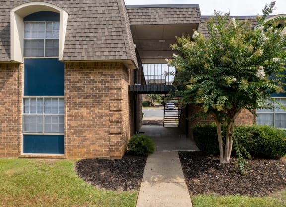 a view of the front of a house with a walkway