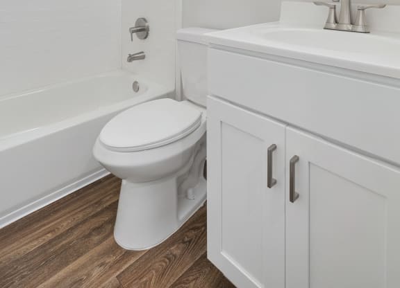 an empty bathroom with a toilet and a sink