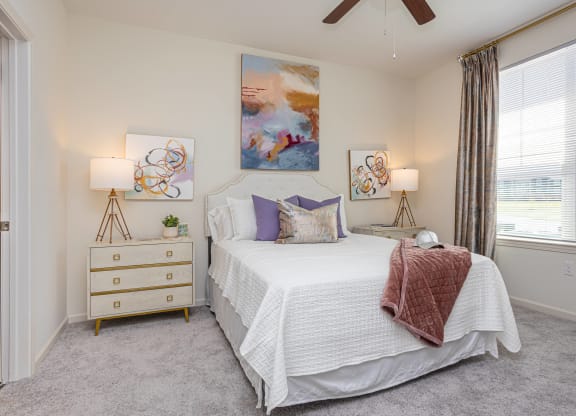 a bedroom with a bed and a dresser
