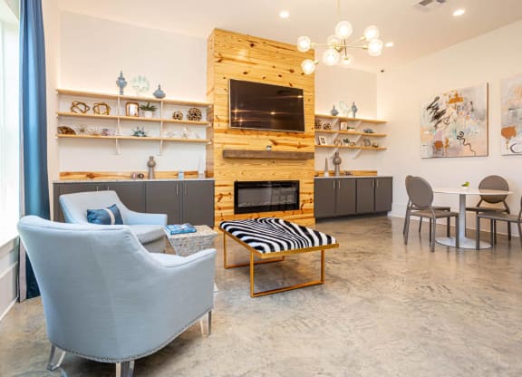a living room with a couch and a fireplace