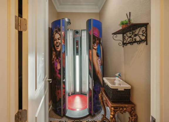 a bathroom with three old fashioned refrigerators in it