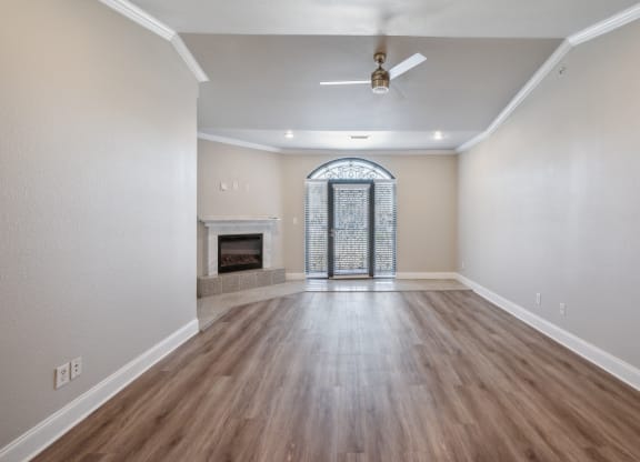 expansive living room with ceiling fan at the Versailles