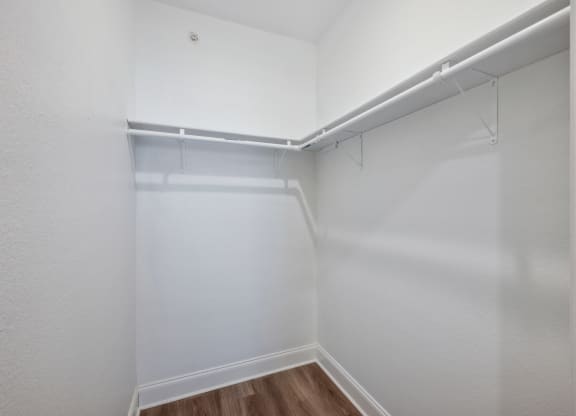 the preserve at ballantyne commons empty bedroom with white walls and a large closet
