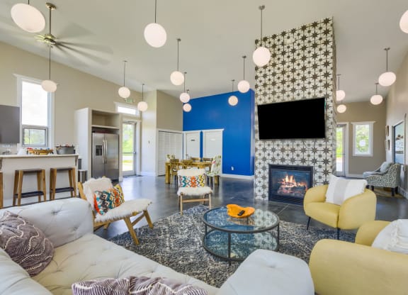 a living room filled with furniture and a flat screen tv