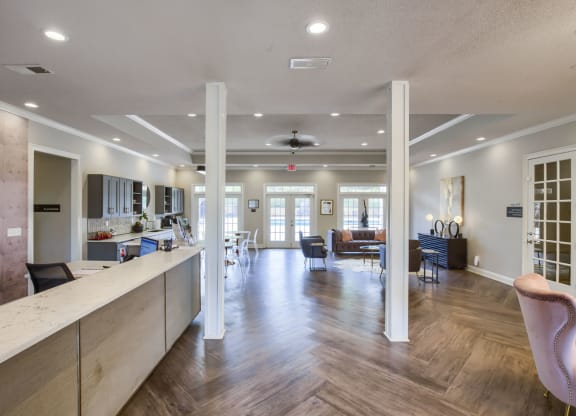 a resident clubhouse with a kitchen and living room