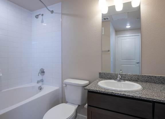 the preserve at ballantyne commons apartment bathroom with sink toilet and tub