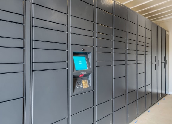 a row of metal lockers with an atm in the middle