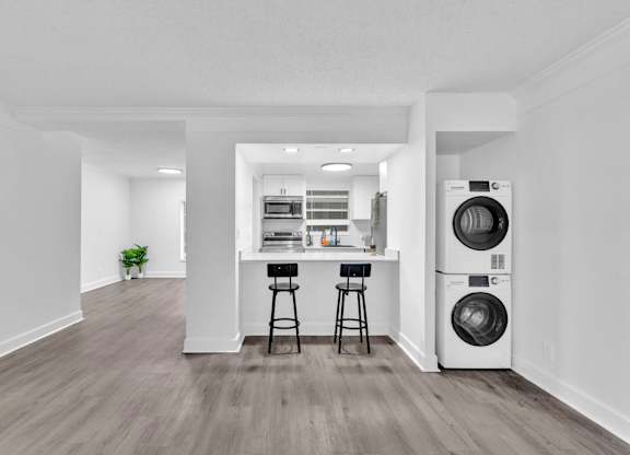 A laundry room with a washer and dryer.
