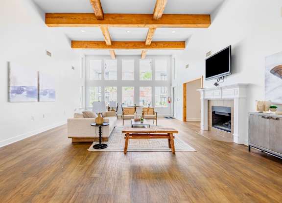 A living room with a fireplace and a television.