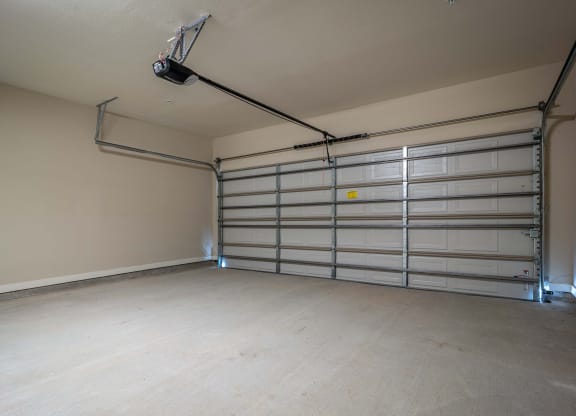 the interior of a garage with a white garage door