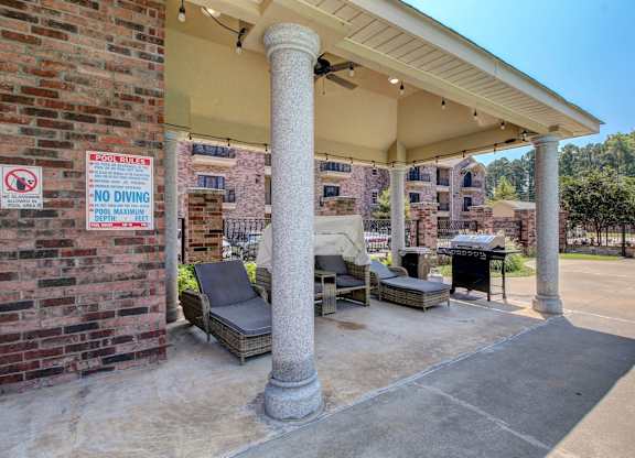 A covered patio area with a no diving sign.