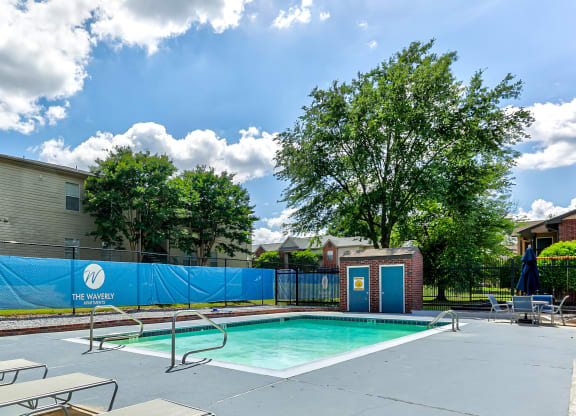 our apartments have a swimming pool and a blue privacy fence