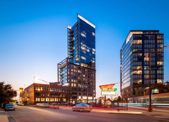 a city street with two tall buildings in the background