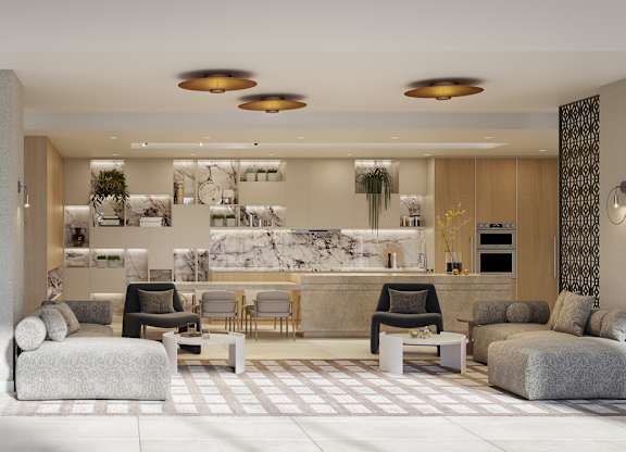 A modern living room with a kitchen in the background.