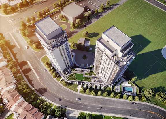 A large building with a pool in front of it.