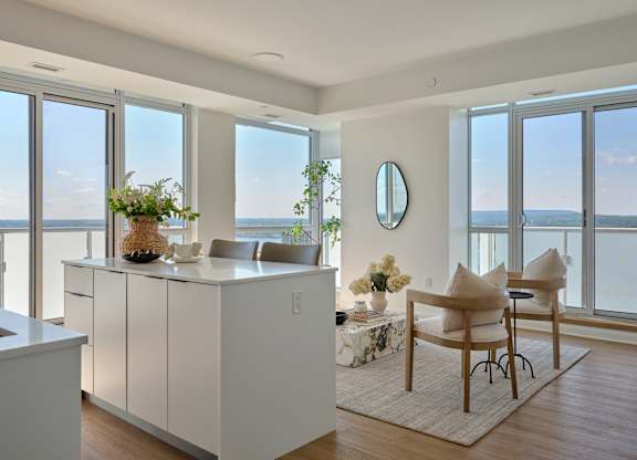 A modern kitchen with a view of the ocean.