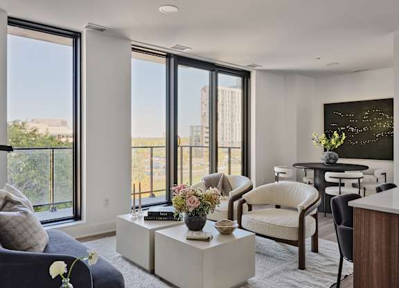 A living room with a view of the city.