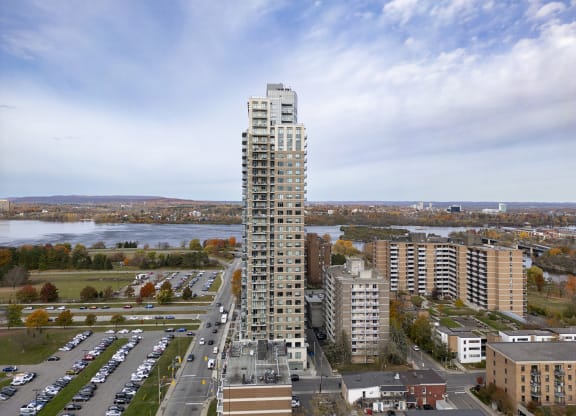 an aerial view of a tall building in a city