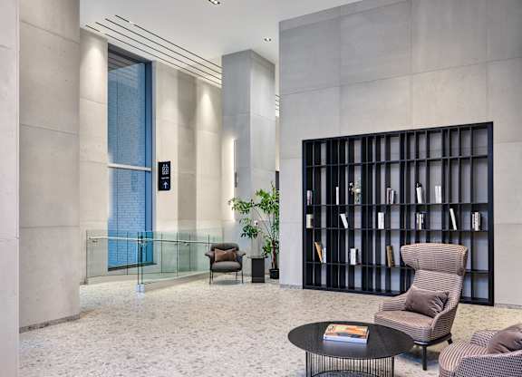 A modern lobby with bookshelf.