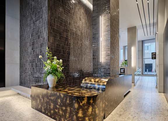 A reception area with a marble counter