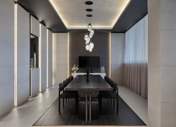 A modern dining room with a long table and chairs.