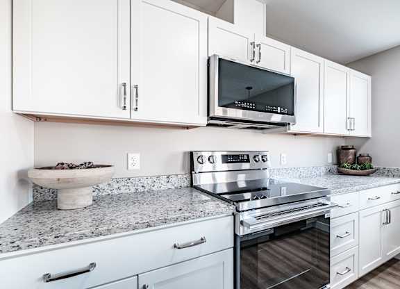 Kitchen with granite countertops and stainless appliances at Windham Village Apartments, Maine, 04062