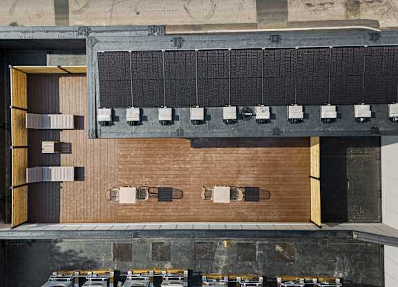 an overhead view of the auditorium of a building with brick walls and a wood