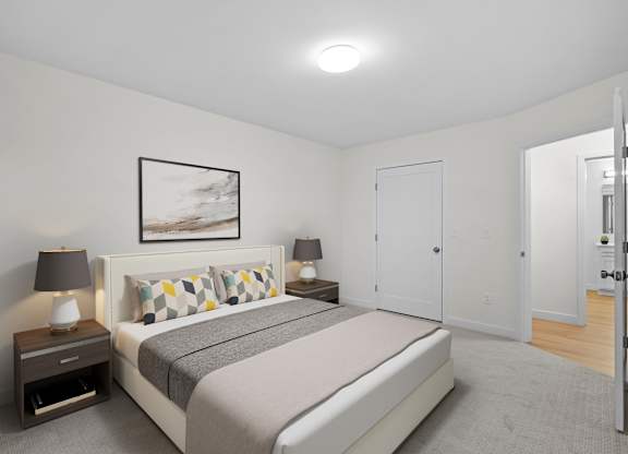 A bedroom with a bed, nightstands, and a painting on the wall.
