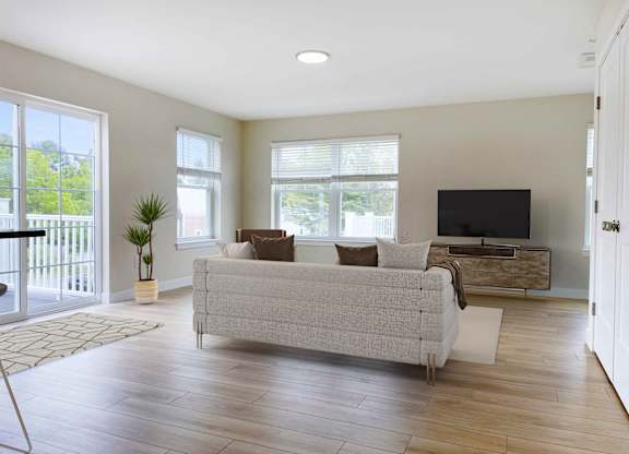 a living room with a couch and a tv