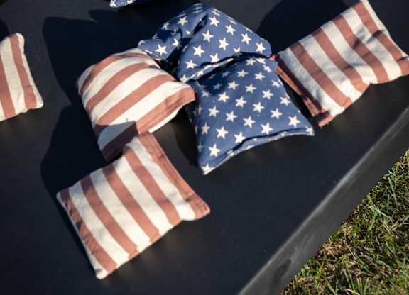 Stars, stripes, and friendly competition—cornhole brings the fun to the lawn at The Summer Kickoff Party