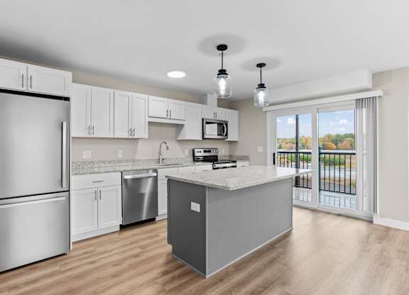 Second-floor units feature private balconies directly off the kitchen — perfect for morning coffee or evening unwinding.