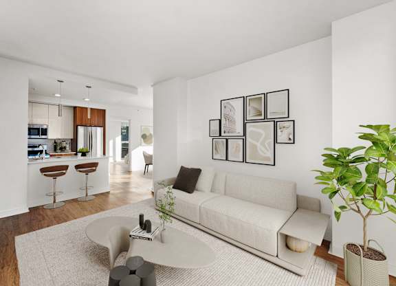A living room with a white couch and a coffee table at Chateau on Wells, Chicago