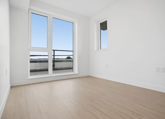 A room with a window and a door.