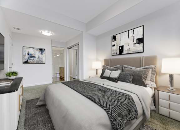 A bedroom with a large bed and a painting on the wall.