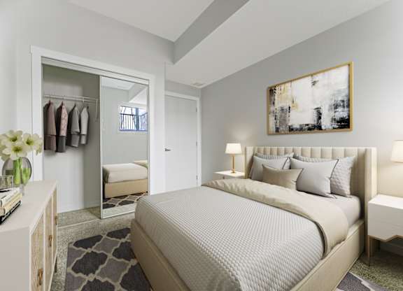 A bedroom with a large bed and a painting on the wall.