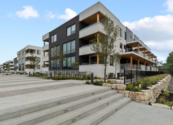 a row of modern buildings with stairs in front of them