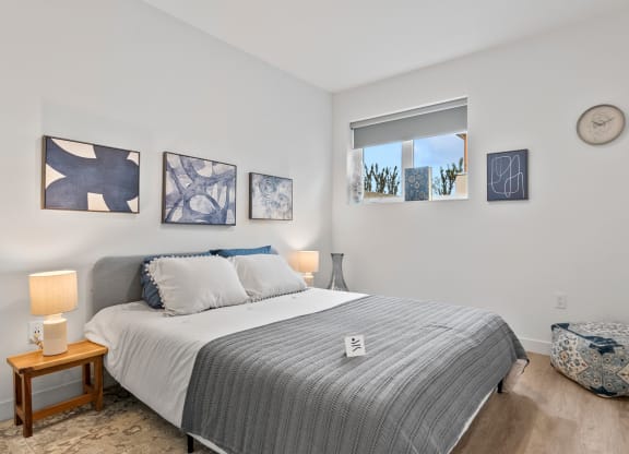 a bedroom with a bed and a window