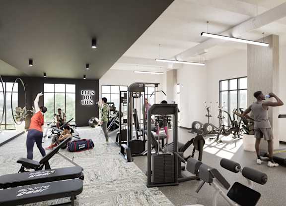 A gym with people working out and various exercise equipment.