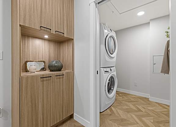 A modern laundry room with a washer and dryer.