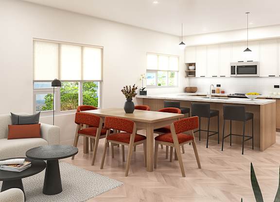 A modern kitchen with a dining table and chairs.