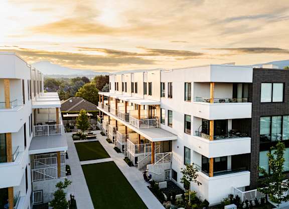 A modern residential complex with white and black buildings.