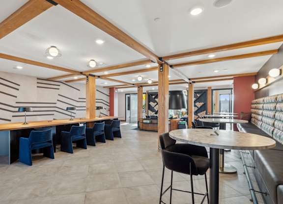 A room with a long table and chairs.